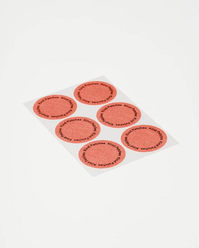 Set of red circular stickers with text on a white background